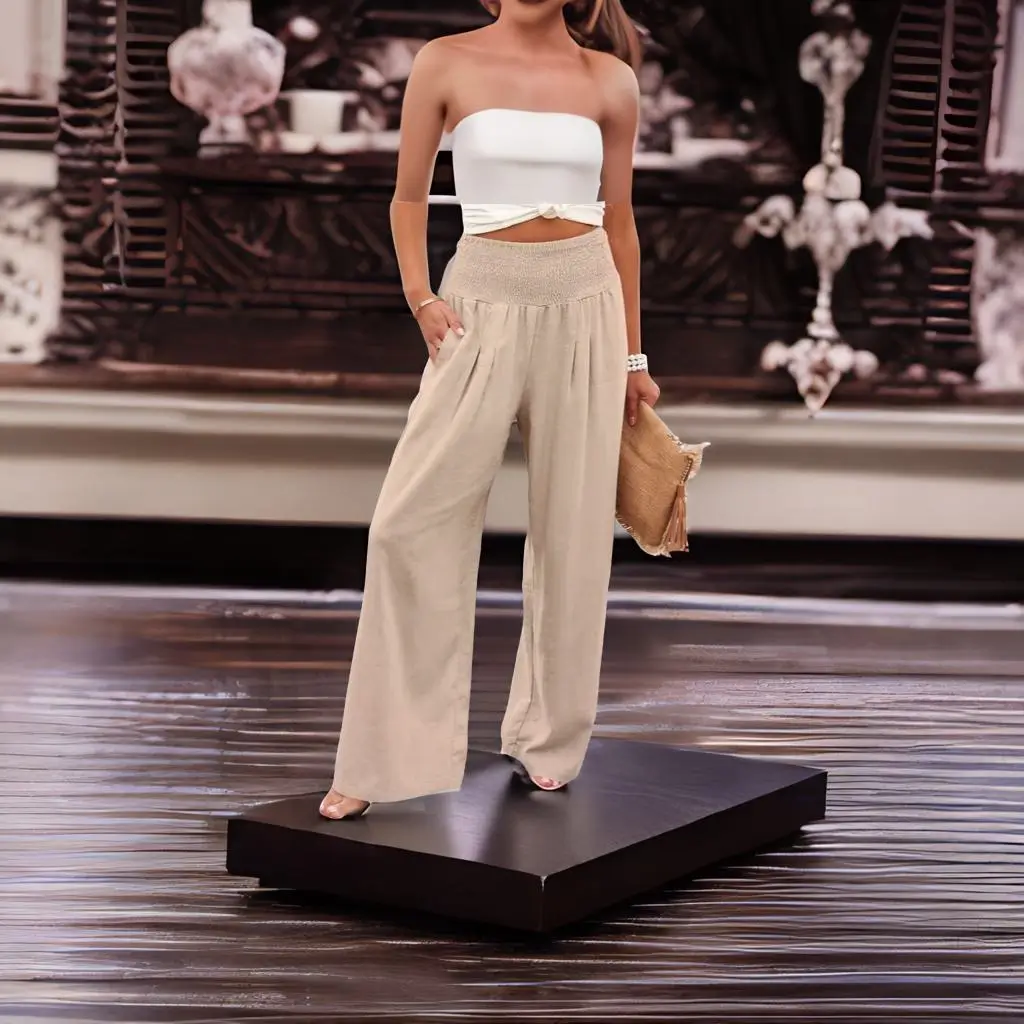 Women's lightweight travel pants with wide-leg design, smocked high waist, and side pockets — ideal for casual wear, vacations, or everyday comfort